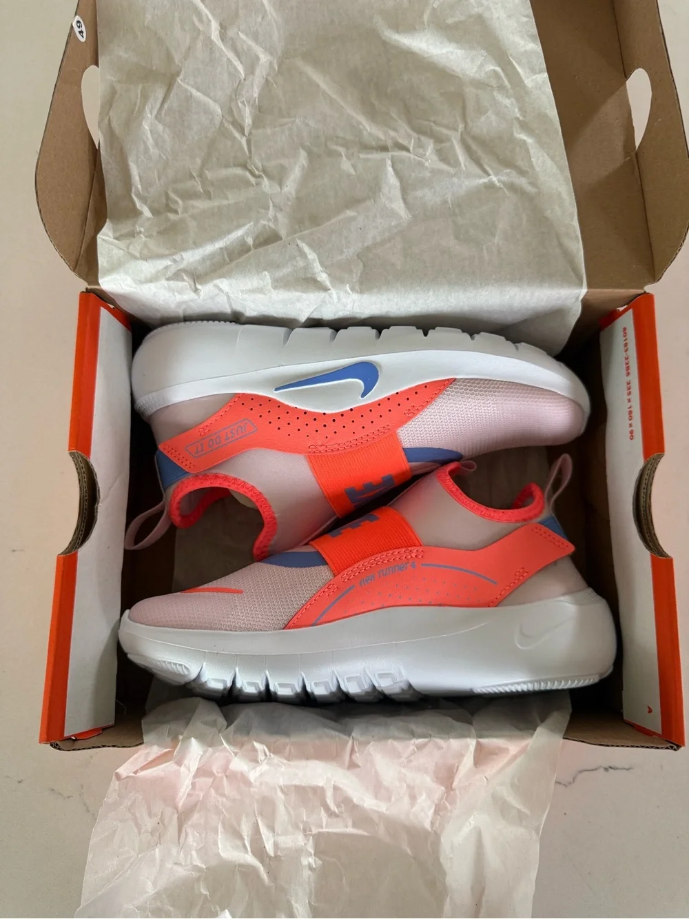 Nike Kids Coral & White Slip-On Sneakers with Blue Swoosh new